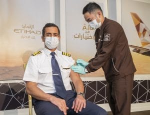 Etihad-pilot-receives-the-COVID-19-vaccine-300x229-min